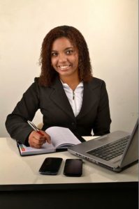 woman writing on notebook